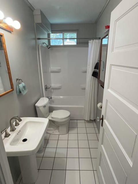 Full bathroom with shampoo, conditioner, and body wash