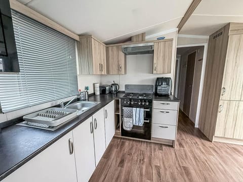 Bright, modern kitchen with ample counter space and natural light