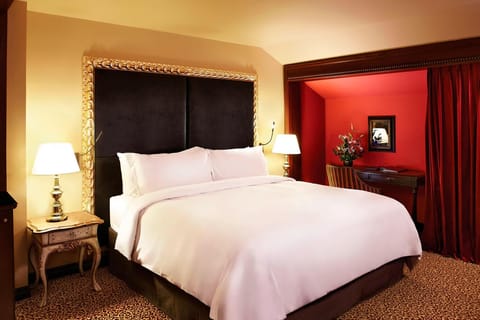 Unwind in a serene bedscape with glowing bedside lamps.
