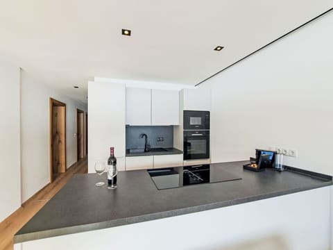 Interior Design, Flooring, Kitchen, Countertop, Floor, Ceiling, Wood, Room, Light Fixture, Cabinetry