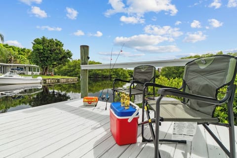 Step onto your private dock—ideal for fishing, launching kayaks, or simply unwinding while enjoying peaceful canal and mangrove views.