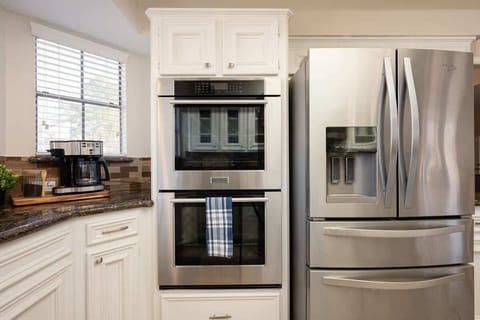 Gourmet Kitchen: Professional-grade appliances await your culinary adventures in style.