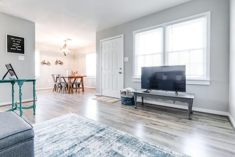 Kick back in comfort on the cozy leather sofa! Enjoy a movie night on the large Roku TV or browse local brochures for things to do—all in a bright, open-concept layout that flows into the kitchen and dining area.