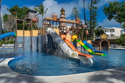 Let the kids race down bright slides into shallow water.
