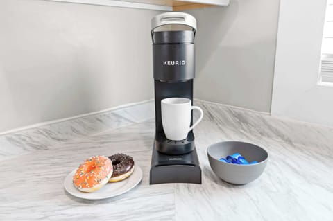 Kitchen: Whip up your favorite meals in this fully equipped kitchen — where modern amenities meet homey charm for a seamless cooking experience.