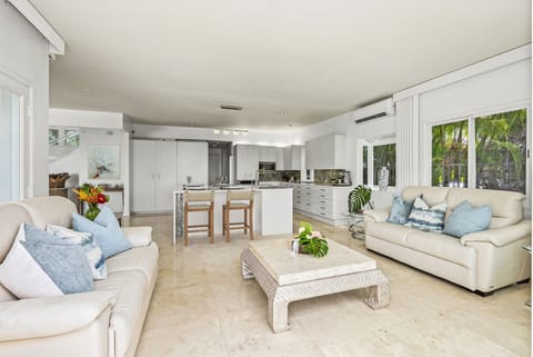 The heart of the home offers seamless flow from the kitchen to lounging and dining—ideal for entertaining with elegance.