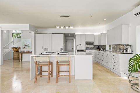 Prep, serve, and socialize with ease at this oversized kitchen island featuring seating and views into the bright great room.