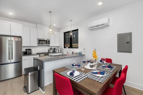 Enjoy the convenience of an open-concept dining and kitchen area, perfect for cooking and gathering in one inviting space.