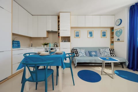 Bright living room combined with kitchenette. 