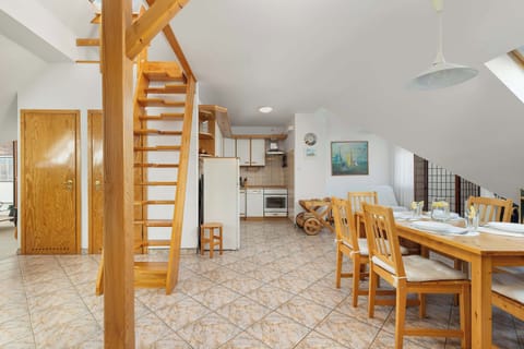 Spacious white interiors with space for food preparation and consumption.