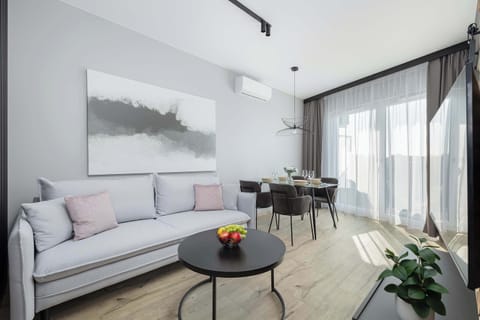 Living room with a comfortable sofa and TV. 