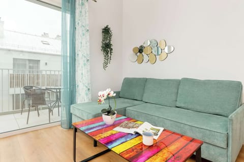 Living room with a comfortable sofa and TV. 
