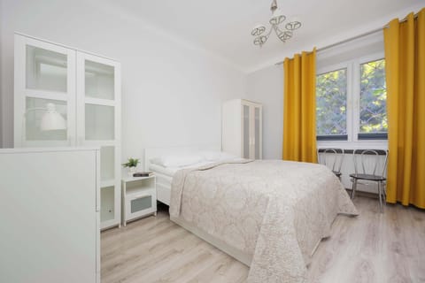 Elegant bedroom with a double bed and cabinets.