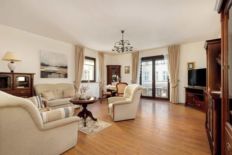 A bright, spacious living room with a settee provides relaxation in comfort.