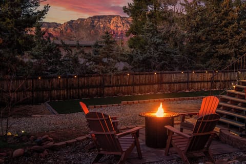 Gather around the fire pit to watch the sun set over the red rocks.