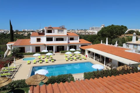 Soak up the day beside the sparkling pool and loungers.