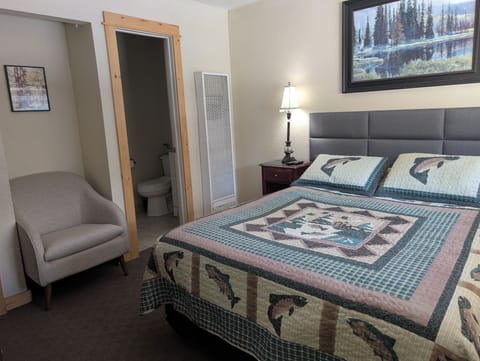 Cozy bedding with fisherman theme throughout the studio. 