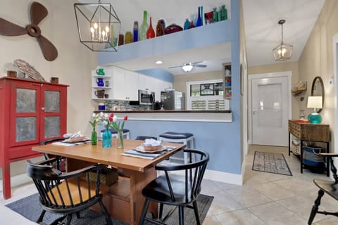 An eating bar with 2 bar stools separates the kitchen from the dining area.