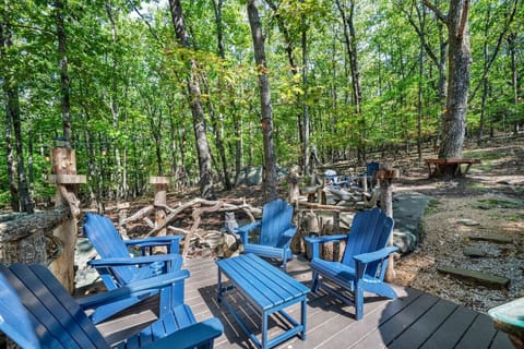 More outdoor table and chairs in the backyard, ideal for meals, drinks, or enjoying the fresh mountain air.