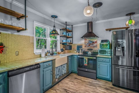 Fully equipped kitchen with stainless steel appliances, fridge with water & ice, stove, oven, microwave, dishwasher, and both drip & Keurig coffee makers—ready for all your cooking adventures.