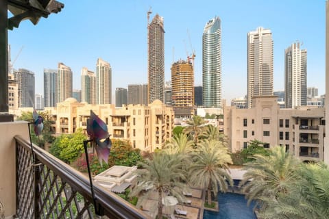 Balcony Oasis: Savor stunning skyline views amid lush greenery and vibrant city life!