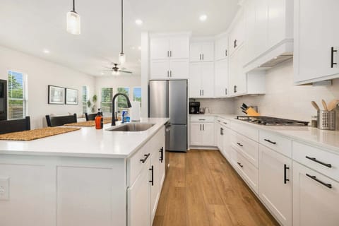 Fully stocked kitchen with high-end amenities, cookware and supplies