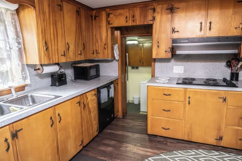 Step down into laundry room, step down again into the pantry & out to BBQ patio.