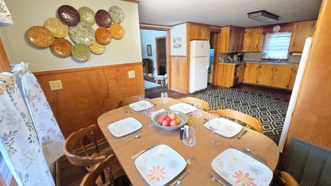 Kitchen opens directly into living room. Dining table seats up to 8.