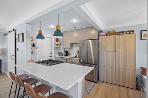 Huge kitchen peninsula with seating.