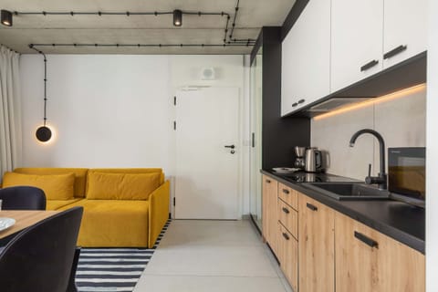 Bright kitchen with cooking utensils. 