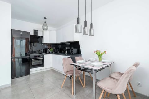 Cook and dine in style with the modern kitchenette and dining area.