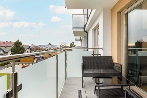 The balcony provides a perfect spot for enjoying the fresh air.