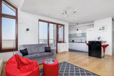 The living area features a flat-screen television.