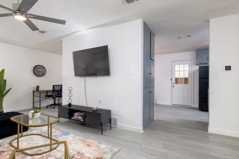 Spacious living room with plenty of seating for friends and family.