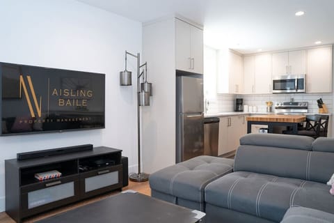 Living room with a comfortable couch, and a Smart TV