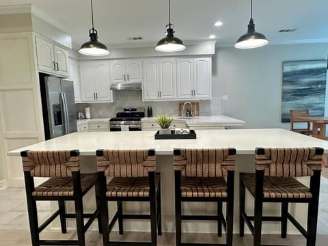 The island can seat four people. The kitchen opens directly to the living area with plenty of seating, so friends and family can gather, chat, and relax while you cook.