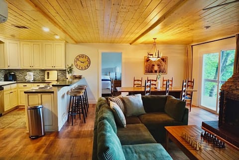 Living Room: Relax in style with a stunning view, wood accents, and game-ready space!