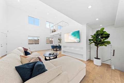 Soaring ceilings and abundant natural light greet you instantly.