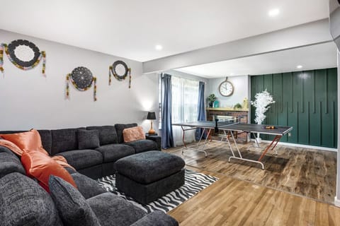 Cozy main living room with large sectional seating—perfect for relaxing with family and friends.