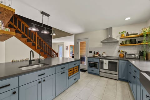 Open-concept kitchen design with direct flow to the dining and living areas, ideal for entertaining.