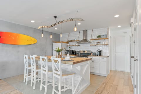 Unit B modern kitchen with barstool seating.