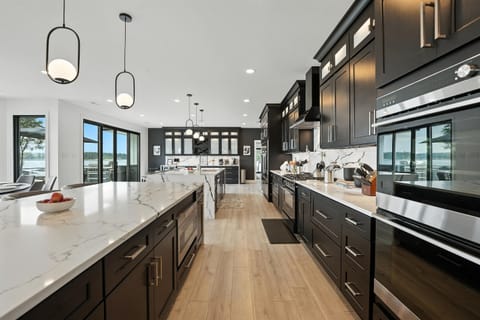 The modern kitchen features two islands - perfect for prep and partying - and includes luxury appliances and ample cabinet space