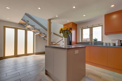 Ground floor: Showing the kitchen and stairway to the first floor