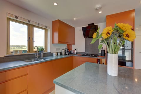 Fantail, Harpley: A cheerful kitchen with a lovely view