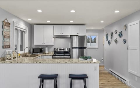 Bright open kitchen with stainless steel appliances