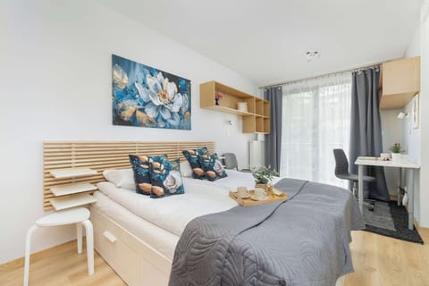 Comfortable bedroom with double bed, Smart TV and access to balcony.