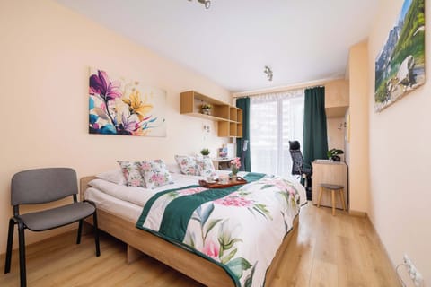 Comfortable bedroom with double bed and access to balcony.