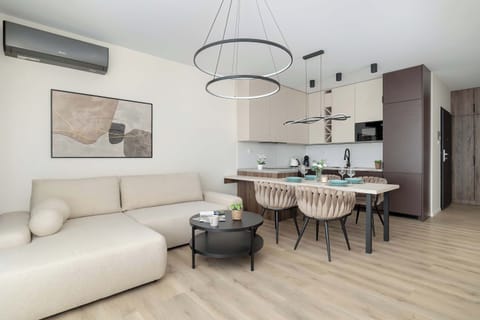 Relax in the stylish living room with a comfortable sofa and modern decor.