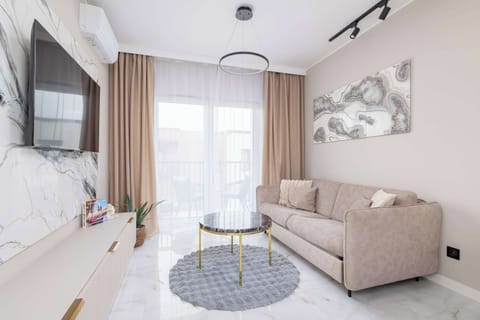 Living room with a comfortable sofa and TV.