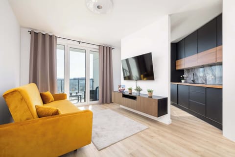 The bright and cozy living room offers a relaxing atmosphere thanks to natural lighting.